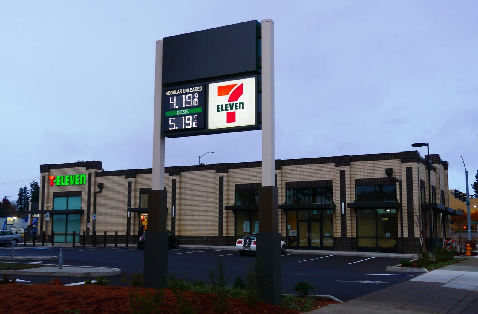 Exterior of a 7-Eleven convenience store storefront with brand signage.