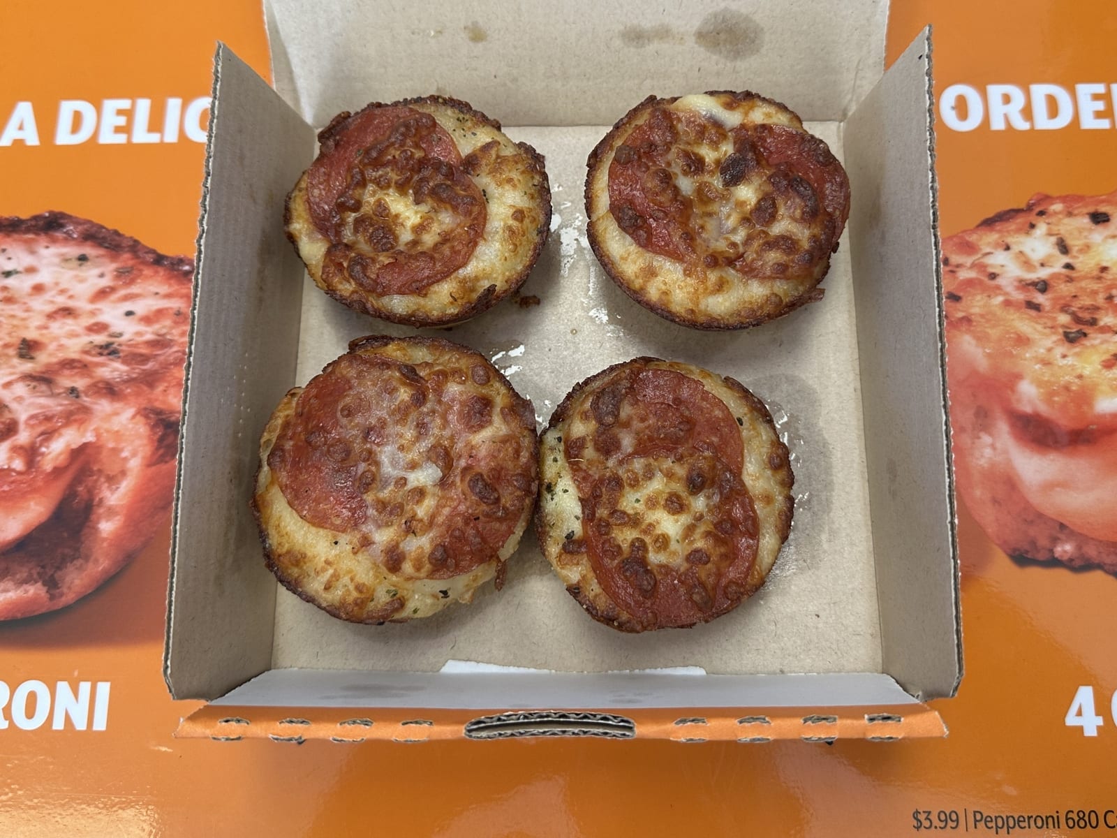 A box of Little Caesars Crazy Puffs, a stuffed menu item, opened on the counter