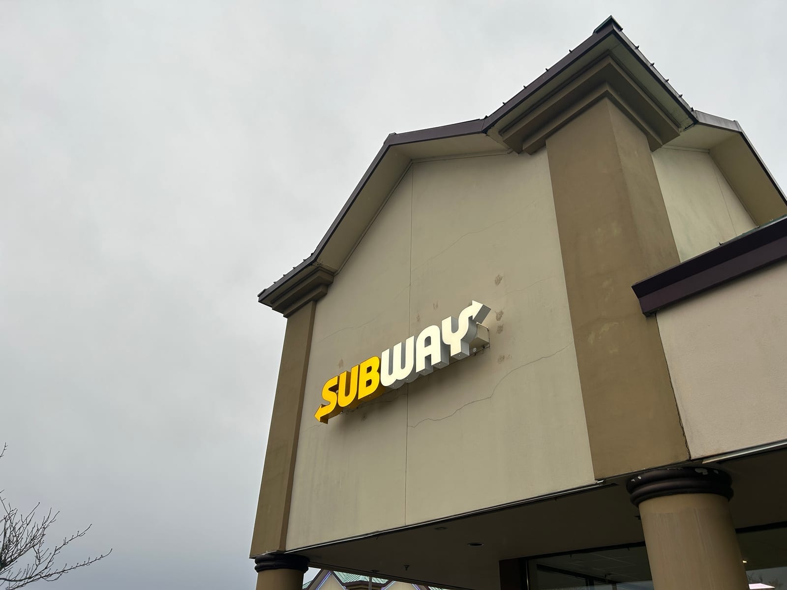 Subway storefront signage mounted on a building exterior